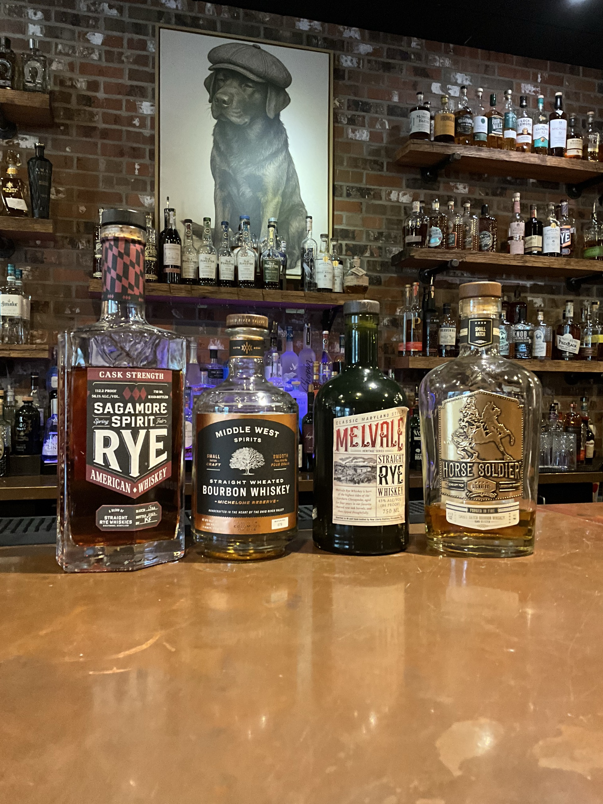Sagamore Cask Strength, Middle West, Melvale, and Horse Soldier whiskey bottles on the Echo's Reserve bar