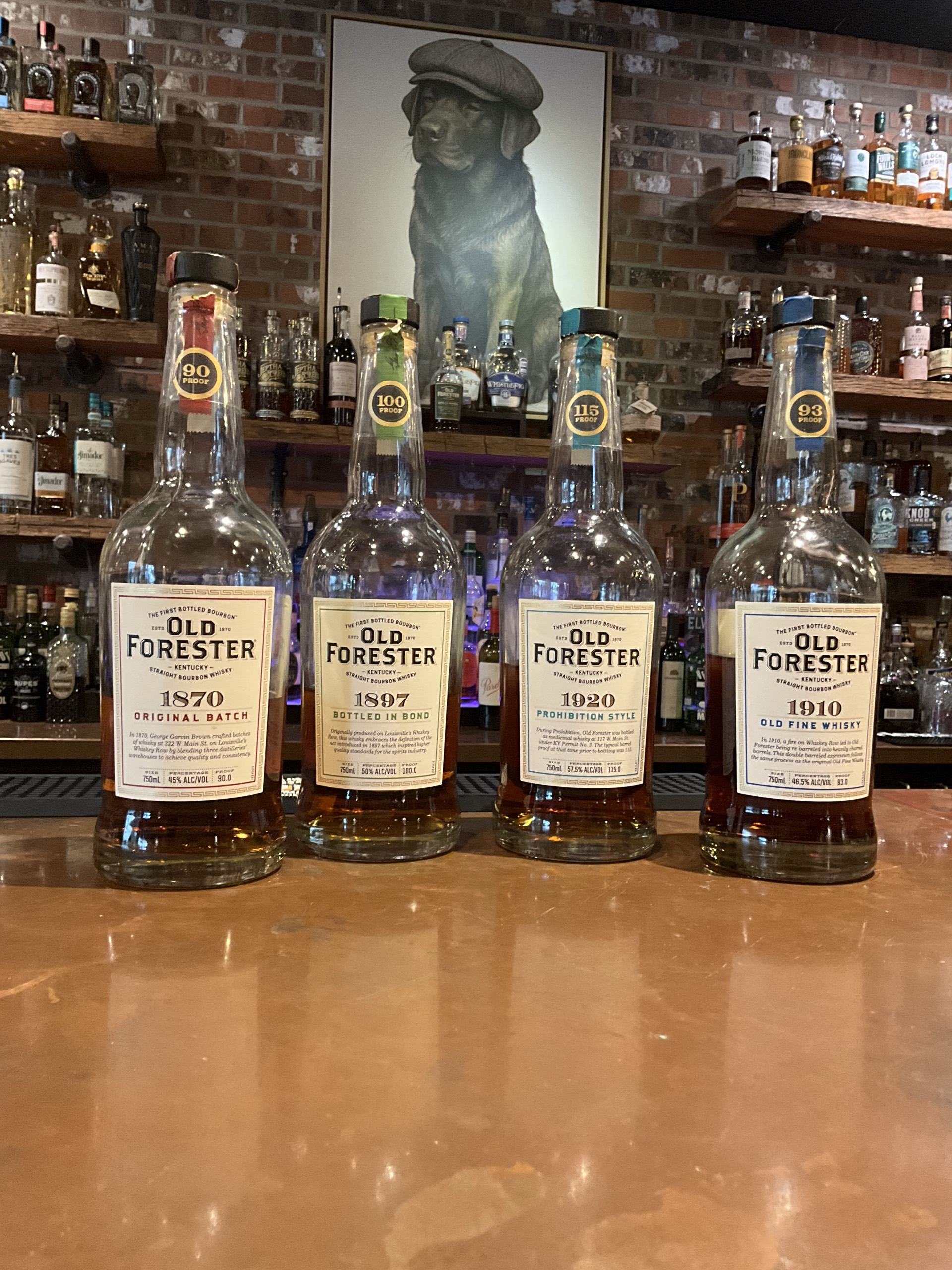 Old Forester 1870, 1897, 1920, and 1910 bottles on the Echo's Reserve bar