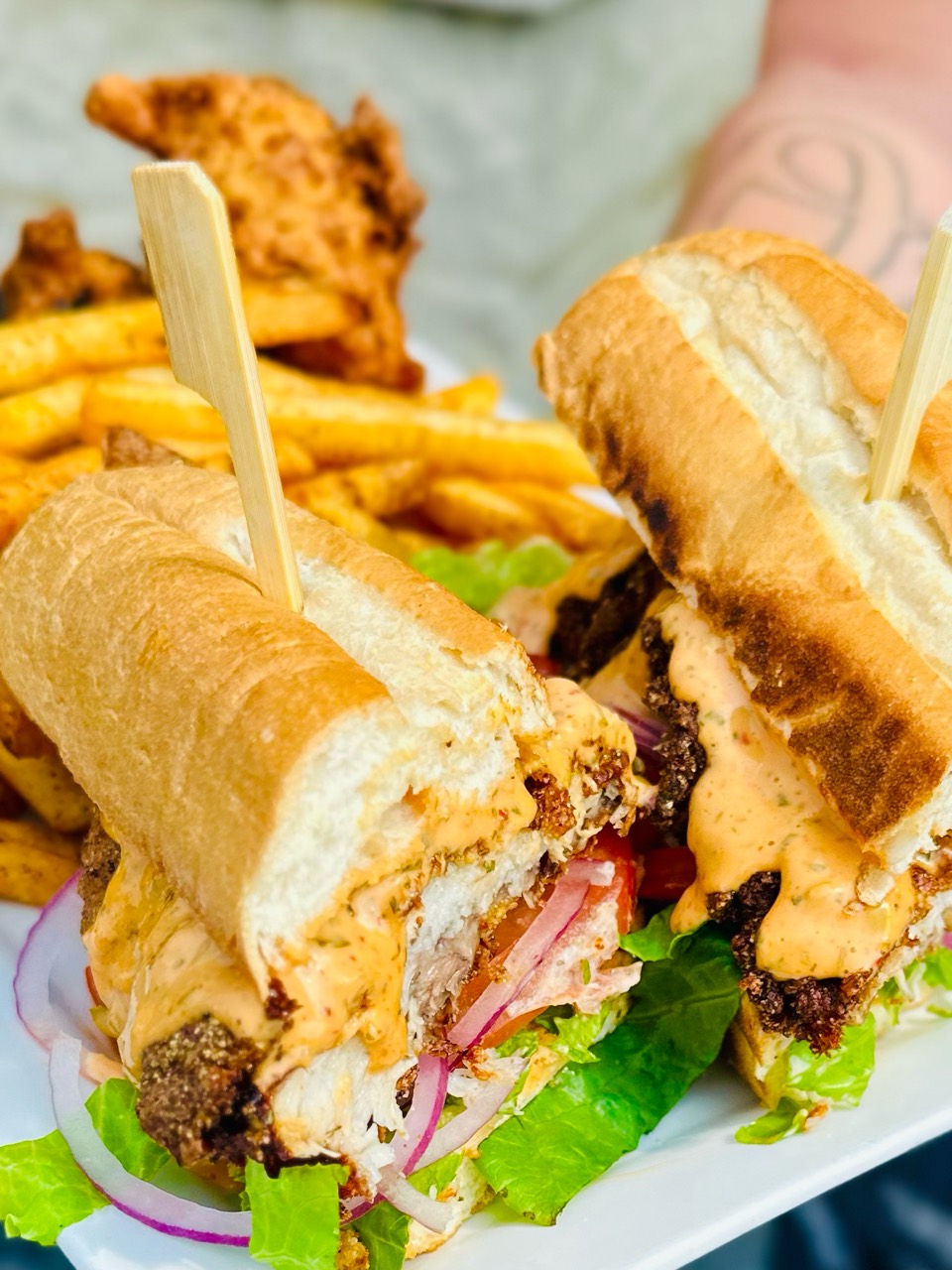 Fried chicken sandwich served with fries