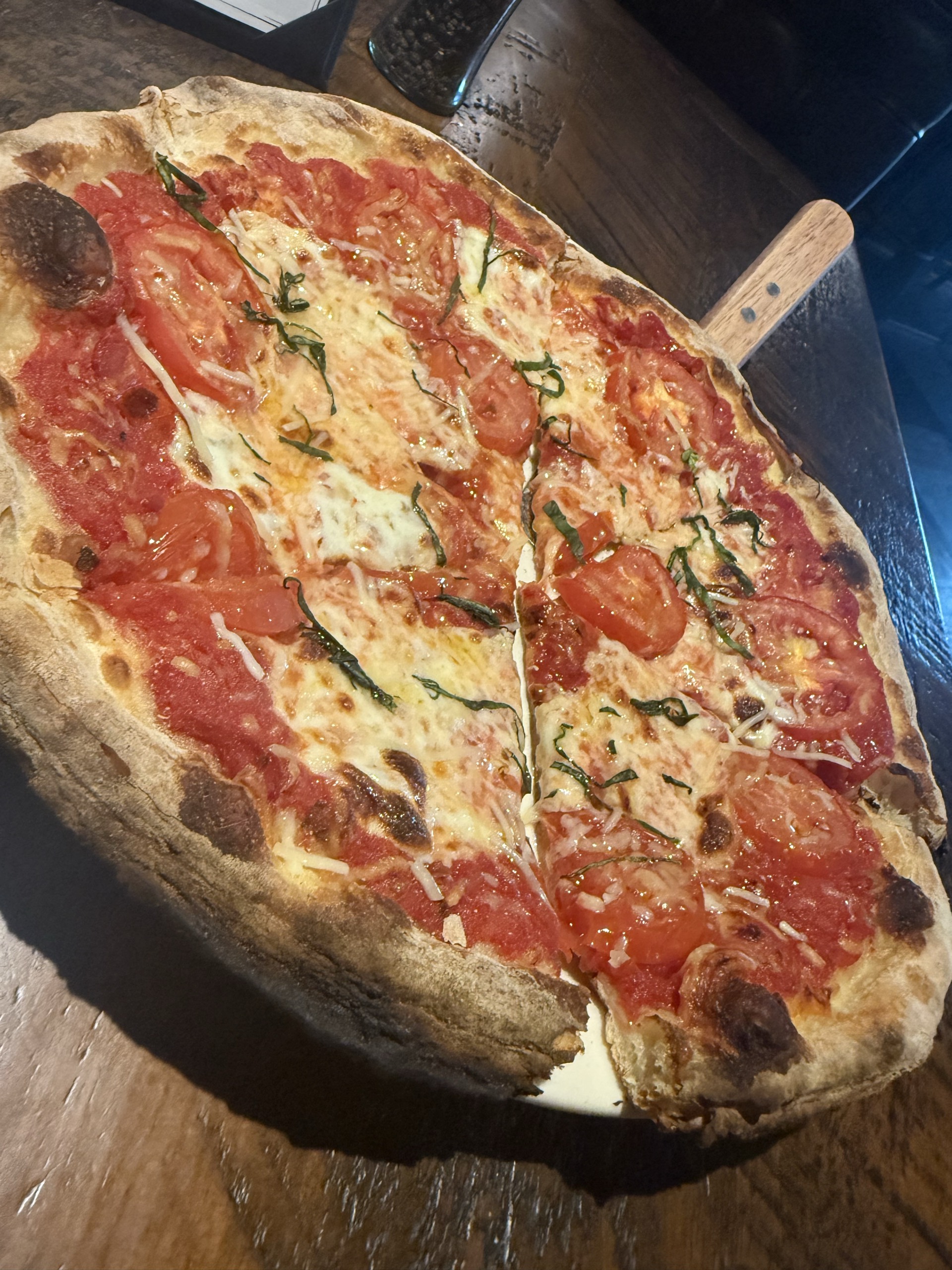 Thin-crust tomato and basil pizza